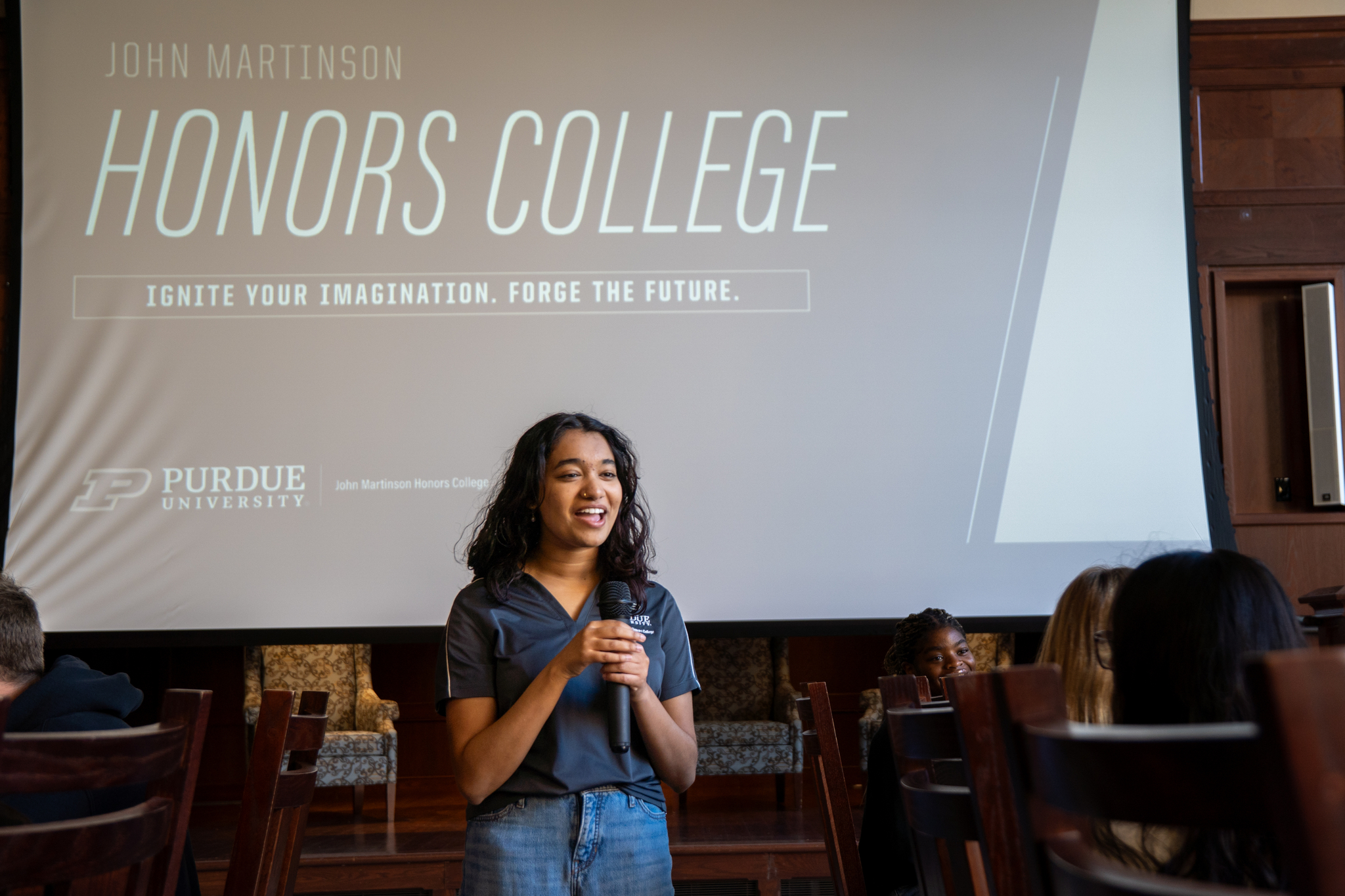 A student giving a presentation in honors hall.